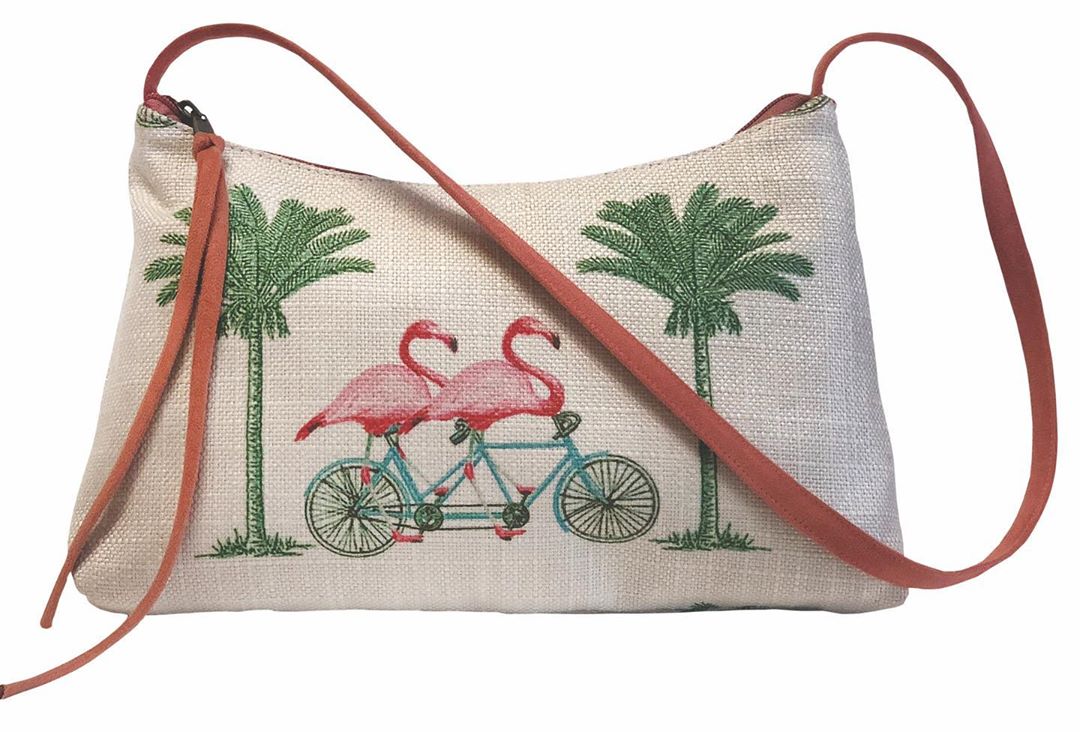 Ready to ride with these two pals on this springy handbag from @atentibags! Get more inspiration in our new Fashion & Accessory Lookbook, link in bio. 🚲