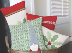Christmas Pillows in a basket by Mélange Collection