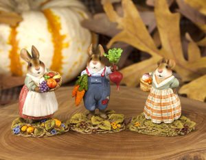 Hand-painted miniature bunnies stand two inches tall. 