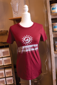 Shining Sol Candle Company also offers local namedrop apparel in its store.