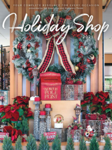 Picture of a holiday display at a gift shop with the Holiday Shop logo on it