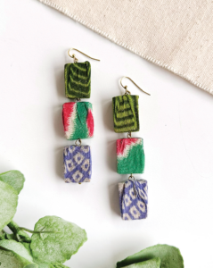Three chunky rectangular Kantha beads dangle in a linear form in these WorldFinds earrings. Incredibly statement-making, this style is surprisingly lightweight. Each bead is made from upcycled Kantha textiles, so colors and patterns are all one-of-a-kind and will vary. Sustainably handmade by women artisans in India.